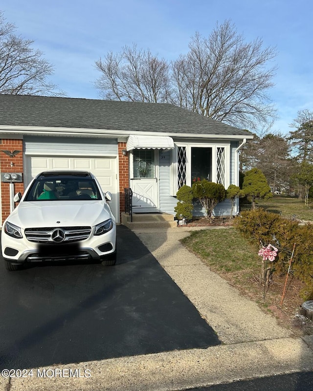 3B Hamilton Ln, Whiting, NJ 08759 - view of front of house featuring an attached garage, brick siding, asphalt driveway, and roof with shingles