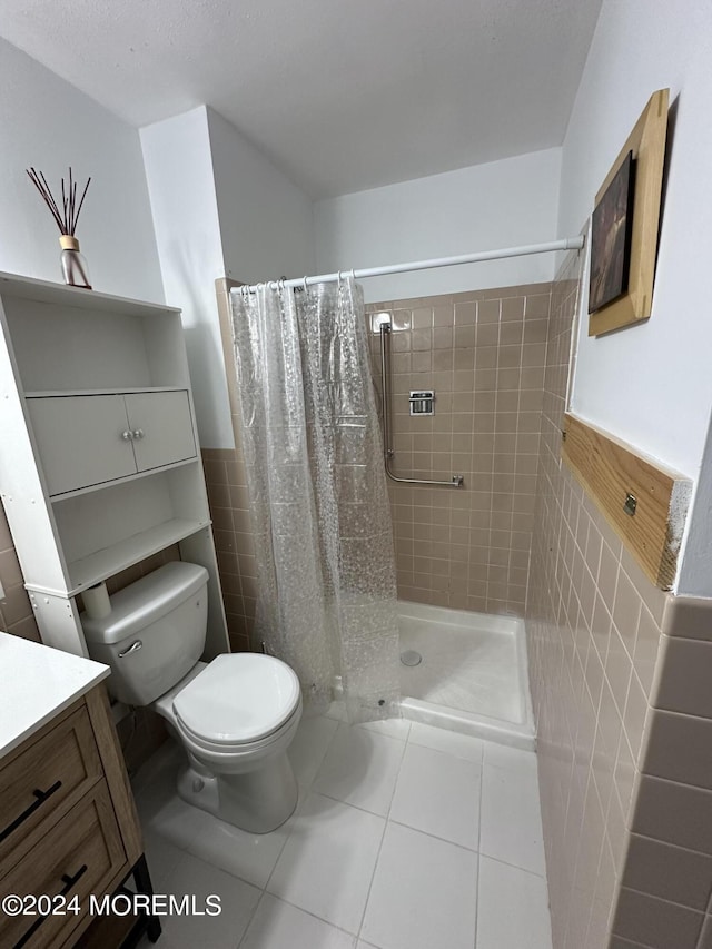 3B Hamilton Ln, Whiting, NJ 08759 - full bathroom featuring tile walls, toilet, vanity, a shower stall, and tile patterned floors