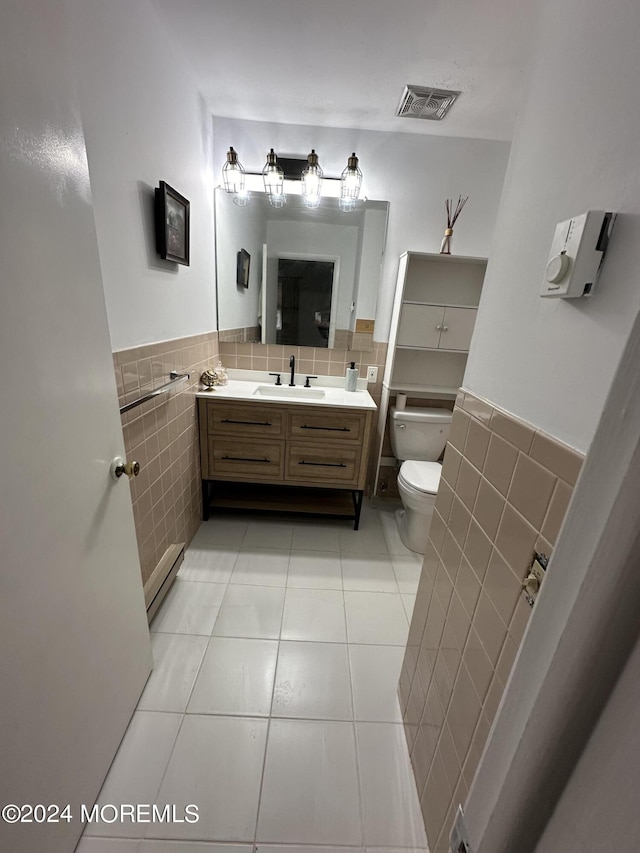 3B Hamilton Ln, Whiting, NJ 08759 - bathroom featuring tile walls, tile patterned floors, toilet, vanity, and wainscoting
