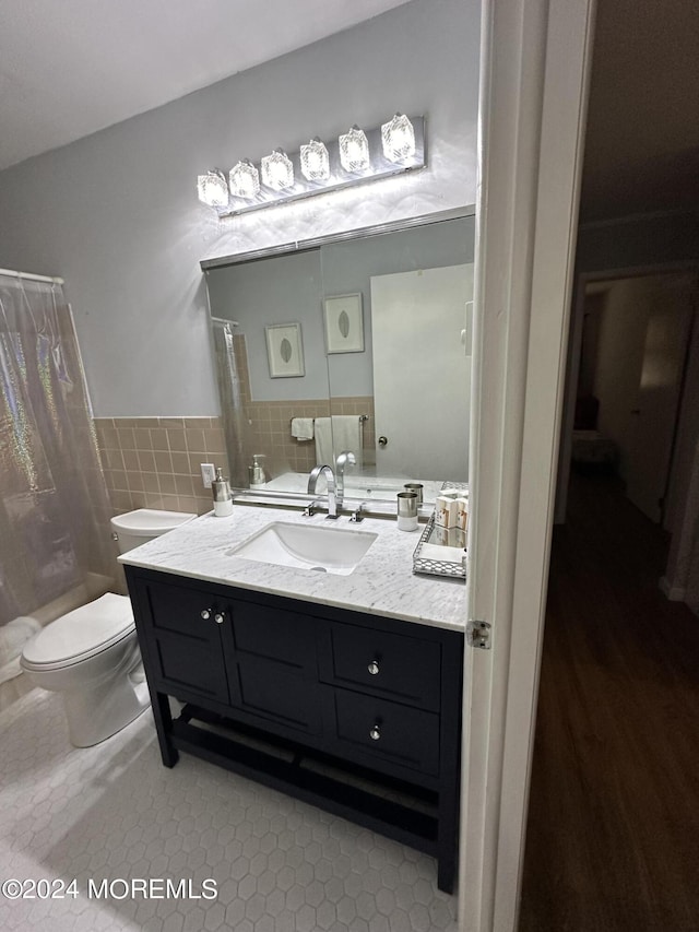 3B Hamilton Ln, Whiting, NJ 08759 - bathroom featuring vanity, toilet, a shower with shower curtain, tile walls, and wainscoting
