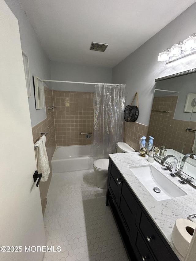 3B Hamilton Ln, Whiting, NJ 08759 - full bathroom with double vanity, shower / tub combo with curtain, toilet, tile walls, and tile patterned flooring