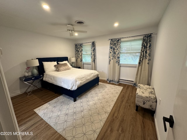 3B Hamilton Ln, Whiting, NJ 08759 - bedroom featuring a baseboard heating unit, wood finished floors, multiple windows, and recessed lighting