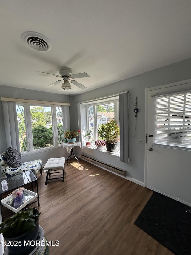 3B Hamilton Ln, Whiting, NJ 08759 - foyer entrance with a baseboard heating unit, wood finished floors, and a ceiling fan