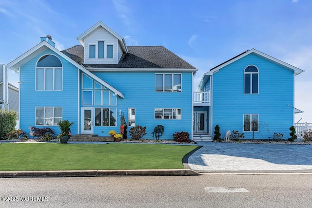 3504 Churchill Dr, Toms River, NJ 08753 - traditional-style home featuring a balcony, a front lawn, and a chimney