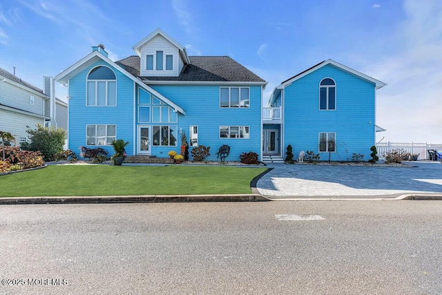 3504 Churchill Dr, Toms River, NJ 08753 - view of front of property featuring a balcony and a front lawn