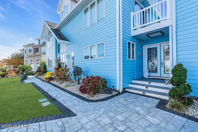 3504 Churchill Dr, Toms River, NJ 08753 - view of home's exterior featuring a balcony, a yard, and french doors