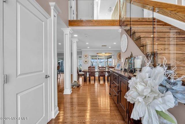 3504 Churchill Dr, Toms River, NJ 08753 - entryway featuring ornate columns, crown molding, wood finished floors, stairway, and recessed lighting