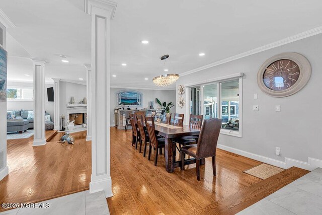 3504 Churchill Dr, Toms River, NJ 08753 - dining space featuring decorative columns, ornamental molding, light wood finished floors, recessed lighting, and baseboards
