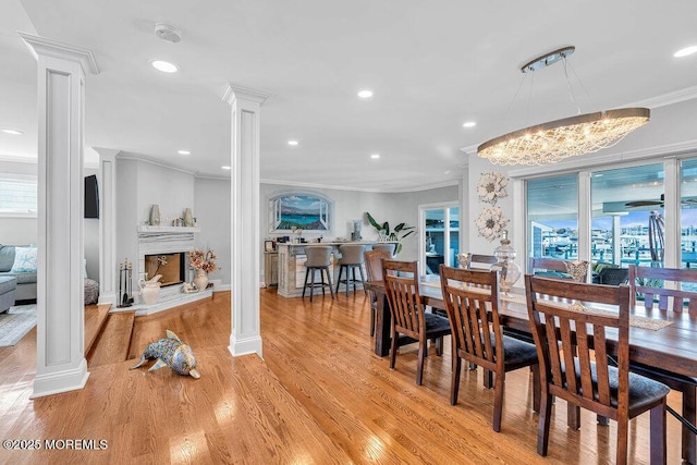 3504 Churchill Dr, Toms River, NJ 08753 - dining room featuring decorative columns, ornamental molding, healthy amount of natural light, recessed lighting, and light wood finished floors
