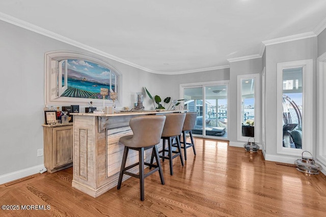 3504 Churchill Dr, Toms River, NJ 08753 - indoor bar featuring light wood finished floors, ornamental molding, and baseboards