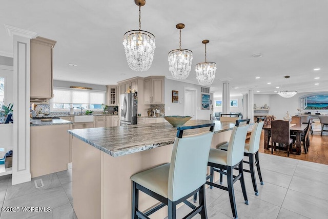 3504 Churchill Dr, Toms River, NJ 08753 - kitchen with stainless steel fridge, a chandelier, a sink, cream cabinets, and recessed lighting