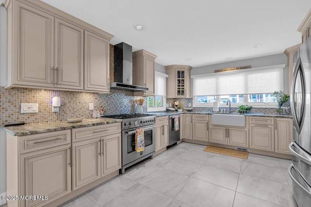 3504 Churchill Dr, Toms River, NJ 08753 - kitchen featuring appliances with stainless steel finishes, wall chimney exhaust hood, cream cabinetry, a sink, and backsplash