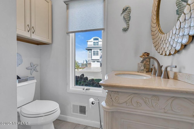 3504 Churchill Dr, Toms River, NJ 08753 - bathroom featuring toilet, baseboards, and vanity