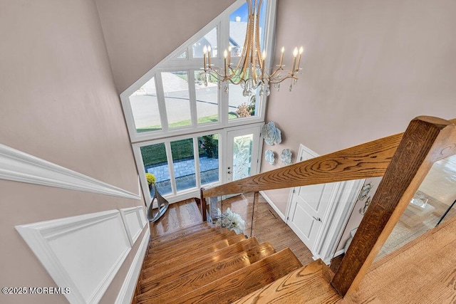 3504 Churchill Dr, Toms River, NJ 08753 - stairway with a chandelier, a towering ceiling, wood finished floors, and french doors