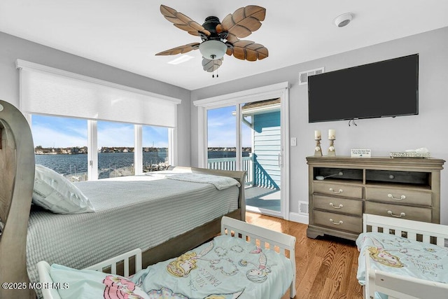 3504 Churchill Dr, Toms River, NJ 08753 - bedroom featuring access to outside, light wood finished floors, a water view, baseboards, and ceiling fan