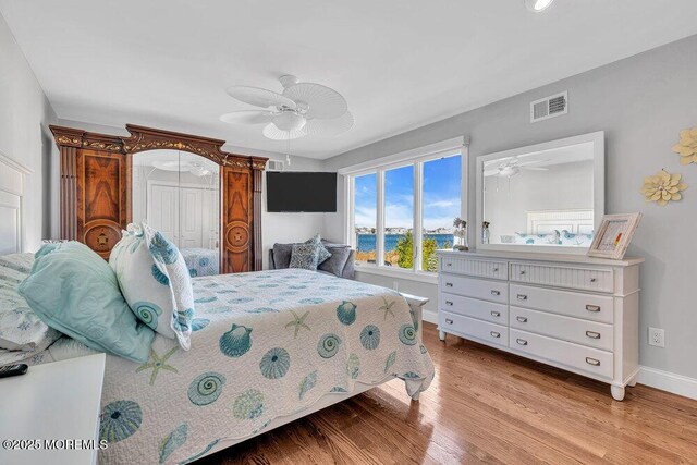 3504 Churchill Dr, Toms River, NJ 08753 - bedroom featuring baseboards, light wood-style floors, and ceiling fan