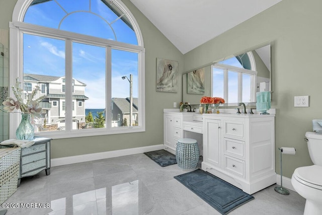 3504 Churchill Dr, Toms River, NJ 08753 - full bathroom with vaulted ceiling, toilet, double vanity, and baseboards