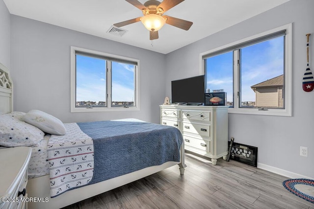 3504 Churchill Dr, Toms River, NJ 08753 - bedroom featuring multiple windows, wood finished floors, baseboards, and ceiling fan