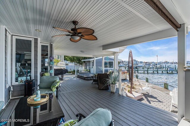 3504 Churchill Dr, Toms River, NJ 08753 - wooden terrace featuring a water view, a ceiling fan, and a boat dock