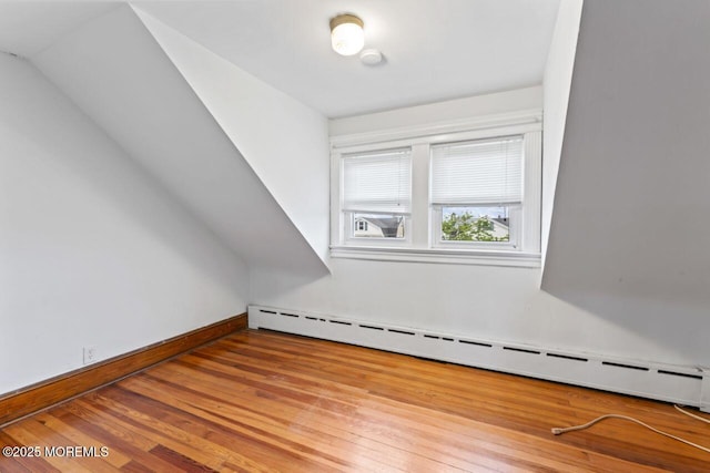 208 4th Ave, Belmar, NJ 07719 - bonus room with baseboard heating, wood-type flooring, and baseboards