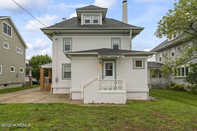 208 4th Ave, Belmar, NJ 07719 - rear view of house featuring a chimney, stucco siding, a yard, and roof with shingles