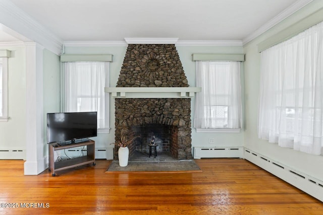 208 4th Ave, Belmar, NJ 07719 - unfurnished living room featuring wood finished floors, a fireplace, plenty of natural light, a baseboard radiator, and ornamental molding