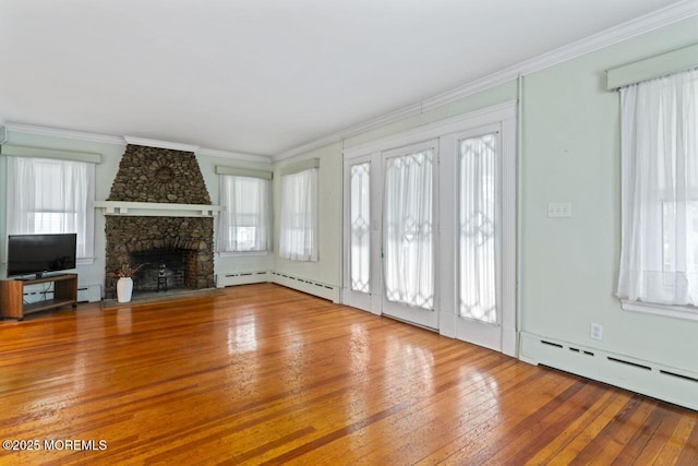 208 4th Ave, Belmar, NJ 07719 - unfurnished living room with wood-type flooring, a baseboard radiator, crown molding, a stone fireplace, and baseboard heating