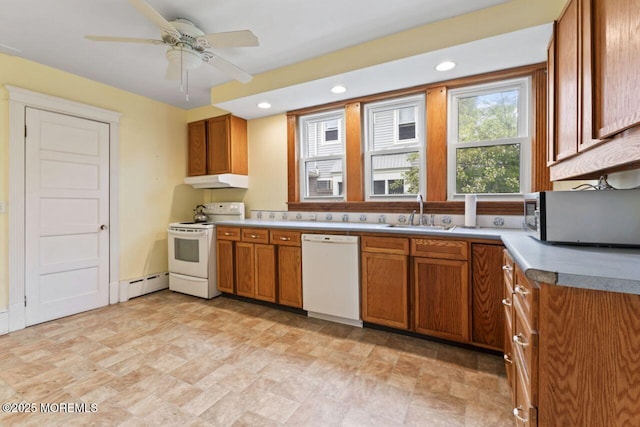 208 4th Ave, Belmar, NJ 07719 - kitchen with white appliances, a sink, a baseboard heating unit, brown cabinetry, and under cabinet range hood