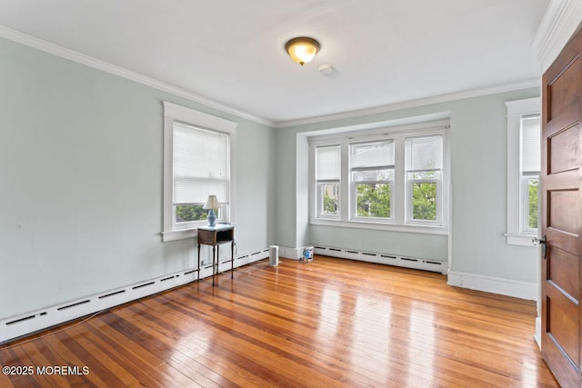 208 4th Ave, Belmar, NJ 07719 - spare room featuring baseboard heating, healthy amount of natural light, light wood-style floors, and ornamental molding