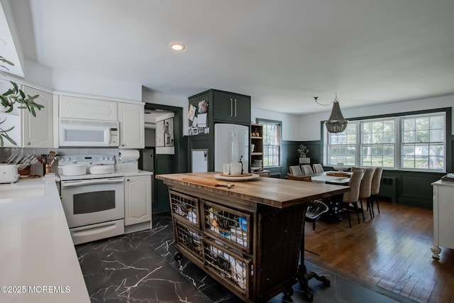 135 Rumson Rd, Rumson, NJ 07760 - kitchen with white appliances, wooden counters, white cabinetry, radiator heating unit, and open shelves