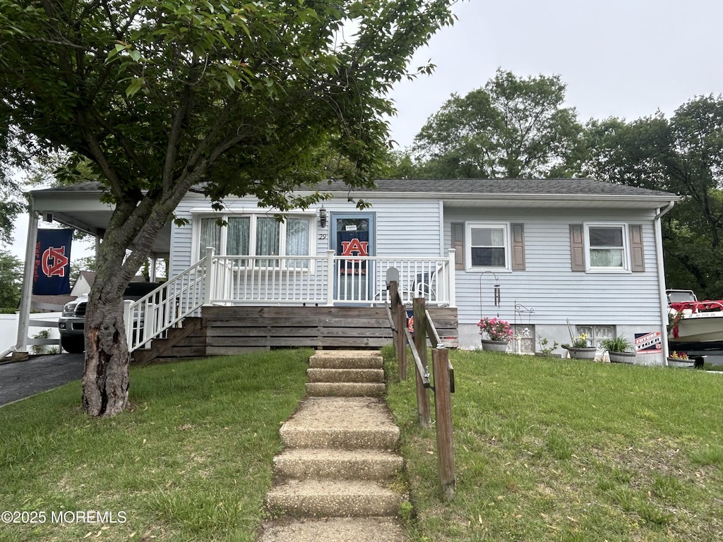 29 Virginia Ave, Hazlet, NJ 07730 - view of front facade with a porch and a front lawn