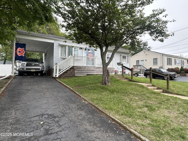 29 Virginia Ave, Hazlet, NJ 07730 - manufactured / mobile home featuring a front yard, driveway, and a carport