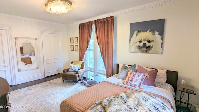 130 Main St, Keyport, NJ 07735 - bedroom with a chandelier, wood finished floors, and ornamental molding