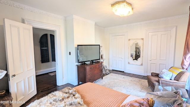 130 Main St, Keyport, NJ 07735 - living area featuring dark wood-type flooring, ornamental molding, and baseboards