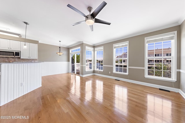 14 Osprey Ln Unit 72, Bayville, NJ 08721 - unfurnished living room featuring ornamental molding, a ceiling fan, and light wood-style floors