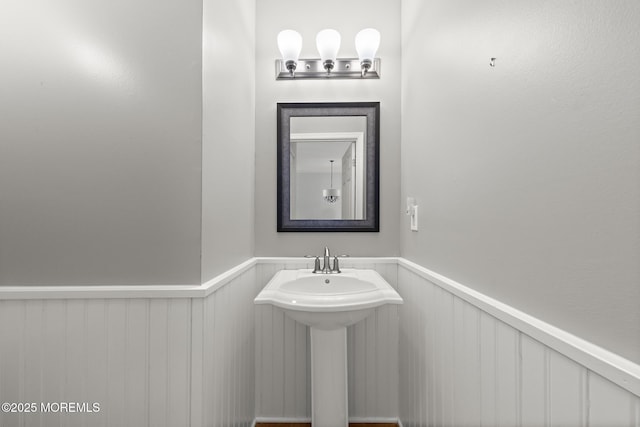 14 Osprey Ln Unit 72, Bayville, NJ 08721 - bathroom featuring a wainscoted wall and a sink