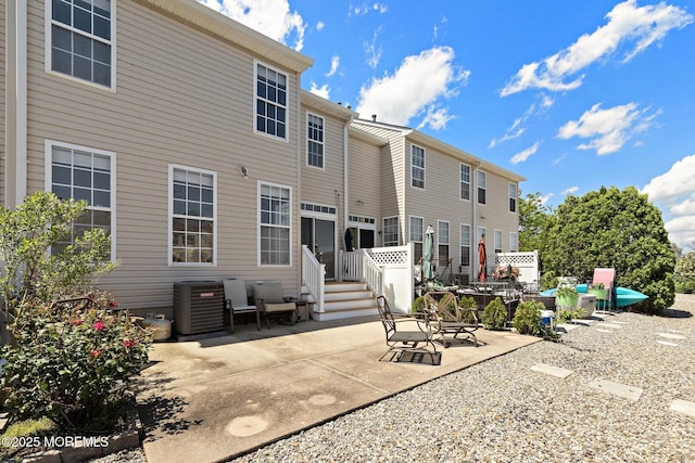 14 Osprey Ln Unit 72, Bayville, NJ 08721 - rear view of house with cooling unit and a patio