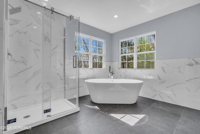 19 Hillside Ave, Barnegat, NJ 08005 - full bathroom featuring tile walls, a marble finish shower, a wainscoted wall, a freestanding tub, and recessed lighting