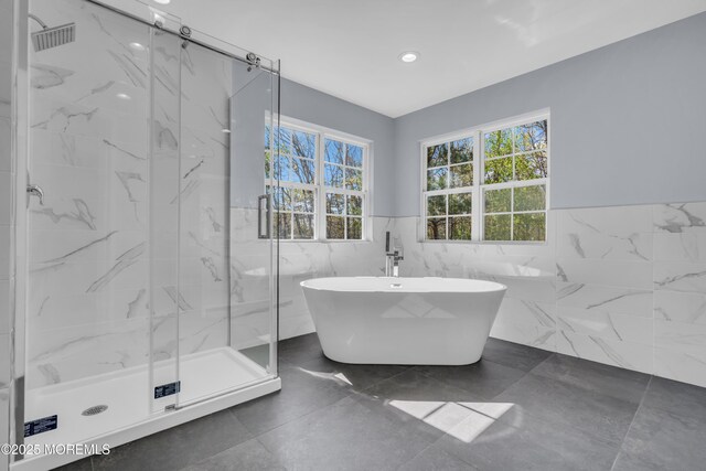 19 Hillside Ave, Barnegat, NJ 08005 - full bathroom featuring tile walls, a marble finish shower, a wainscoted wall, a freestanding tub, and recessed lighting