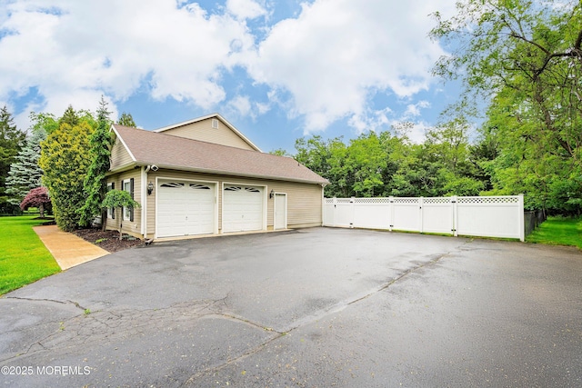 1883 Whitesville Rd, Toms River, NJ 08755 - garage with a gate and asphalt driveway