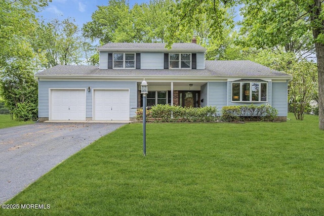 2 Merrick Ct, Middletown, NJ 07748 - traditional home featuring an attached garage, asphalt driveway, a front lawn, and a chimney