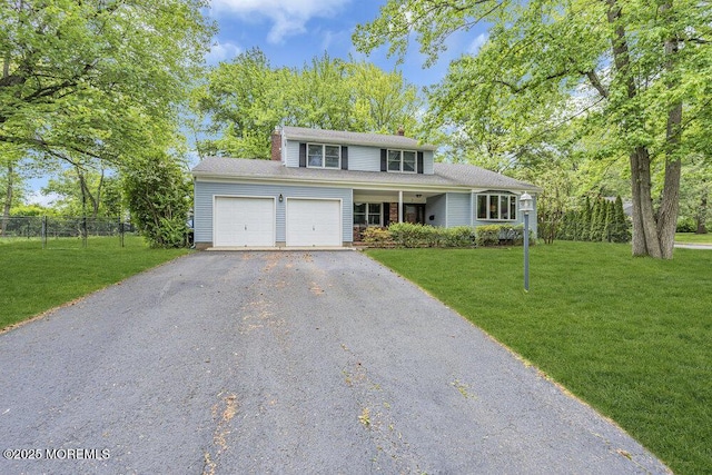 2 Merrick Ct, Middletown, NJ 07748 - traditional-style house with a garage, driveway, and a chimney