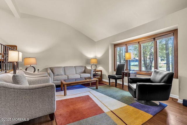 2 Merrick Ct, Middletown, NJ 07748 - living area featuring vaulted ceiling, healthy amount of natural light, baseboards, and wood finished floors