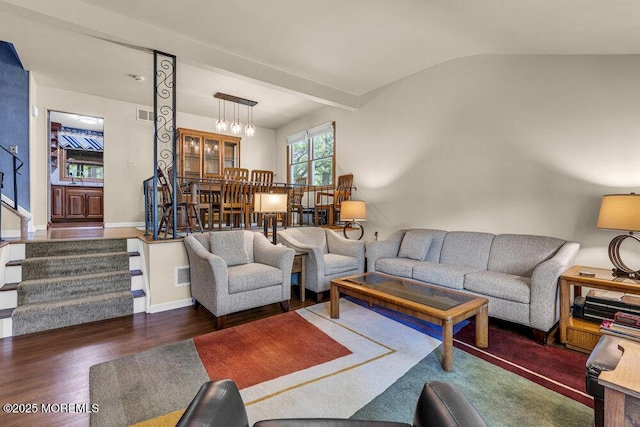 2 Merrick Ct, Middletown, NJ 07748 - living area featuring wood finished floors, vaulted ceiling, baseboards, and a chandelier