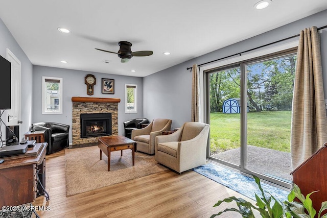 2 Merrick Ct, Middletown, NJ 07748 - living room featuring ceiling fan, a fireplace, light wood finished floors, and recessed lighting