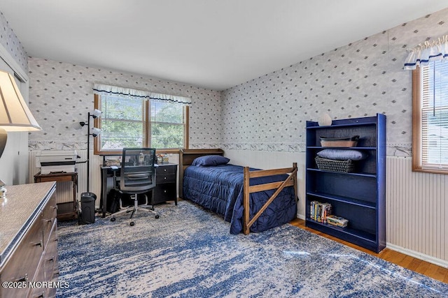 2 Merrick Ct, Middletown, NJ 07748 - bedroom featuring wallpapered walls, wood finished floors, a wainscoted wall, and an office area