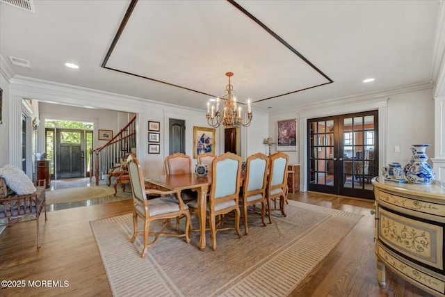 68 Seneca Pl, Oceanport, NJ 07757 - dining area featuring french doors, stairway, crown molding, a chandelier, and wood finished floors