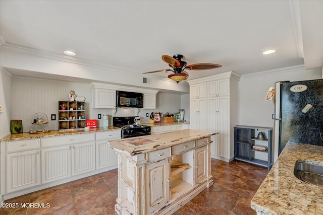 68 Seneca Pl, Oceanport, NJ 07757 - kitchen featuring black appliances, crown molding, ceiling fan, light stone counters, and white cabinetry
