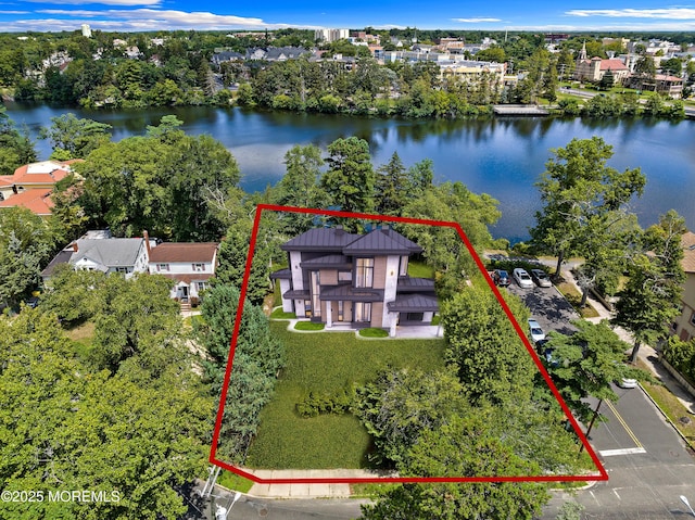 107 S Lake Dr, Lakewood, NJ 08701 - aerial overview of property's location with property boundaries highlighted, a large body of water, and a tree filled landscape