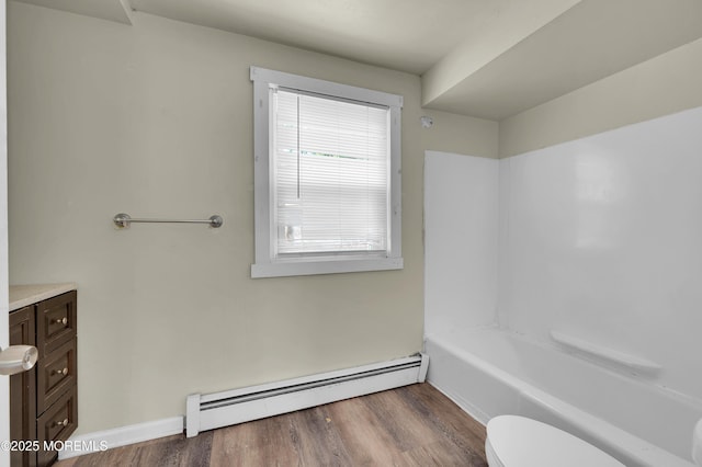 90 Dock Rd, Brick, NJ 08723 - bathroom with a baseboard heating unit, vanity, and wood finished floors